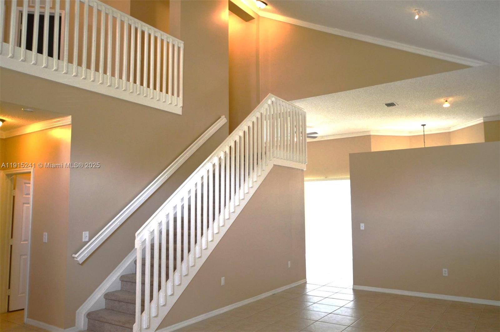 2202 Southeast 17th Avenue Homestead, FL 33035 - Photo 4 of 34 a view of a hallway with staircase