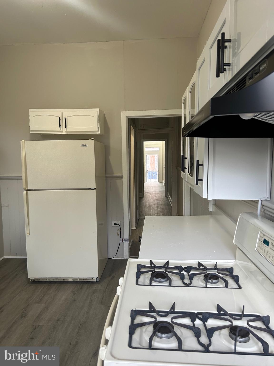 1619 1/2 Division Street Baltimore, MD 21217 - Photo 11 of 22 a kitchen with a stove and a refrigerator