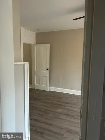 a view of wooden floor in an empty room