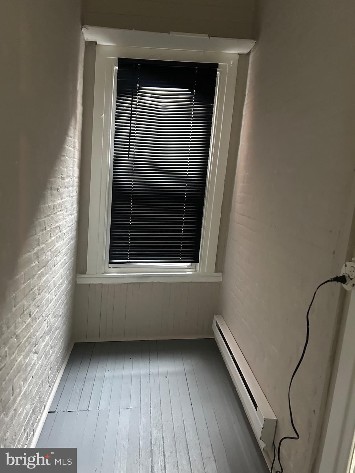 1619 1/2 Division Street Baltimore, MD 21217 - Photo 18 of 22 a view of a balcony with wooden floor and windows