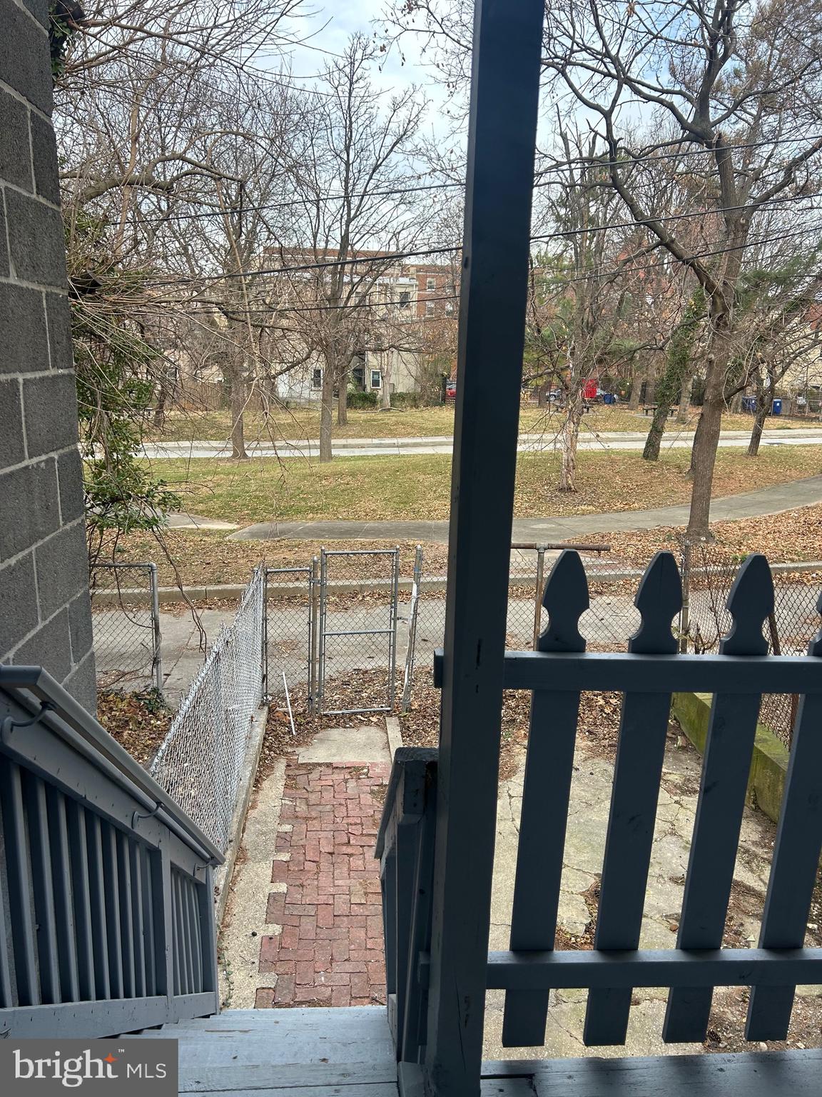 1619 1/2 Division Street Baltimore, MD 21217 - Photo 22 of 22 a view of a porch with wooden floor and fence