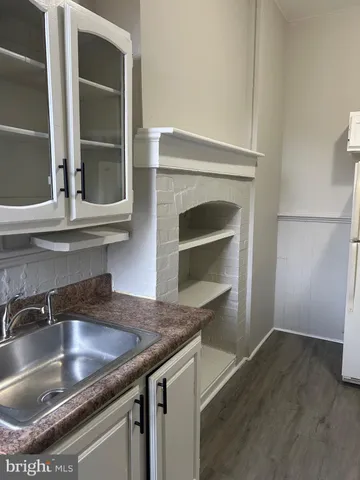 a kitchen with a sink and a window