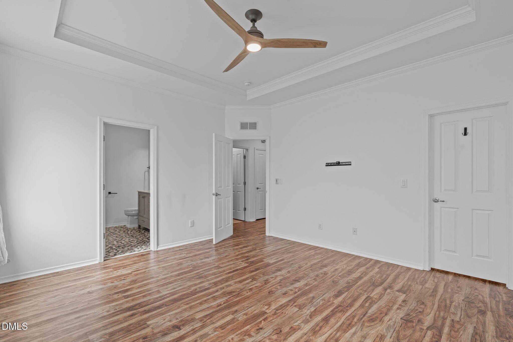 124 Daneborg Road Durham, NC 27703 - Photo 11 of 40 a view of an empty room with wooden floor