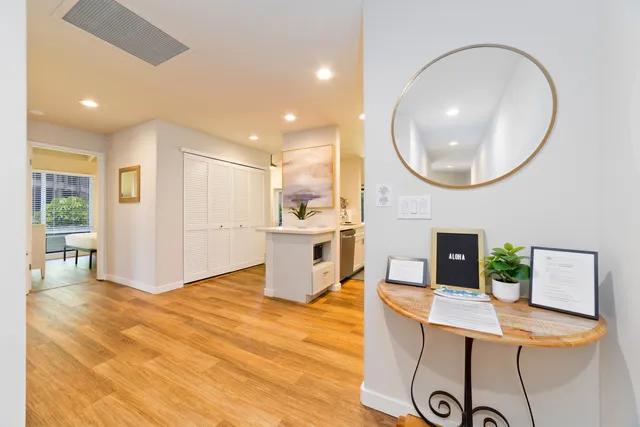 a workspace with furniture and mirror