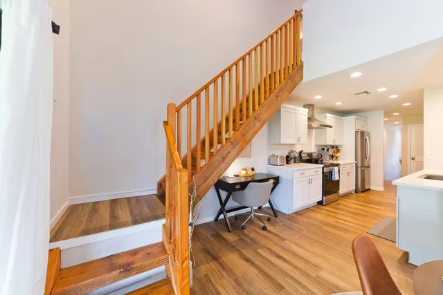 a view of kitchen and dining room with wooden floor
