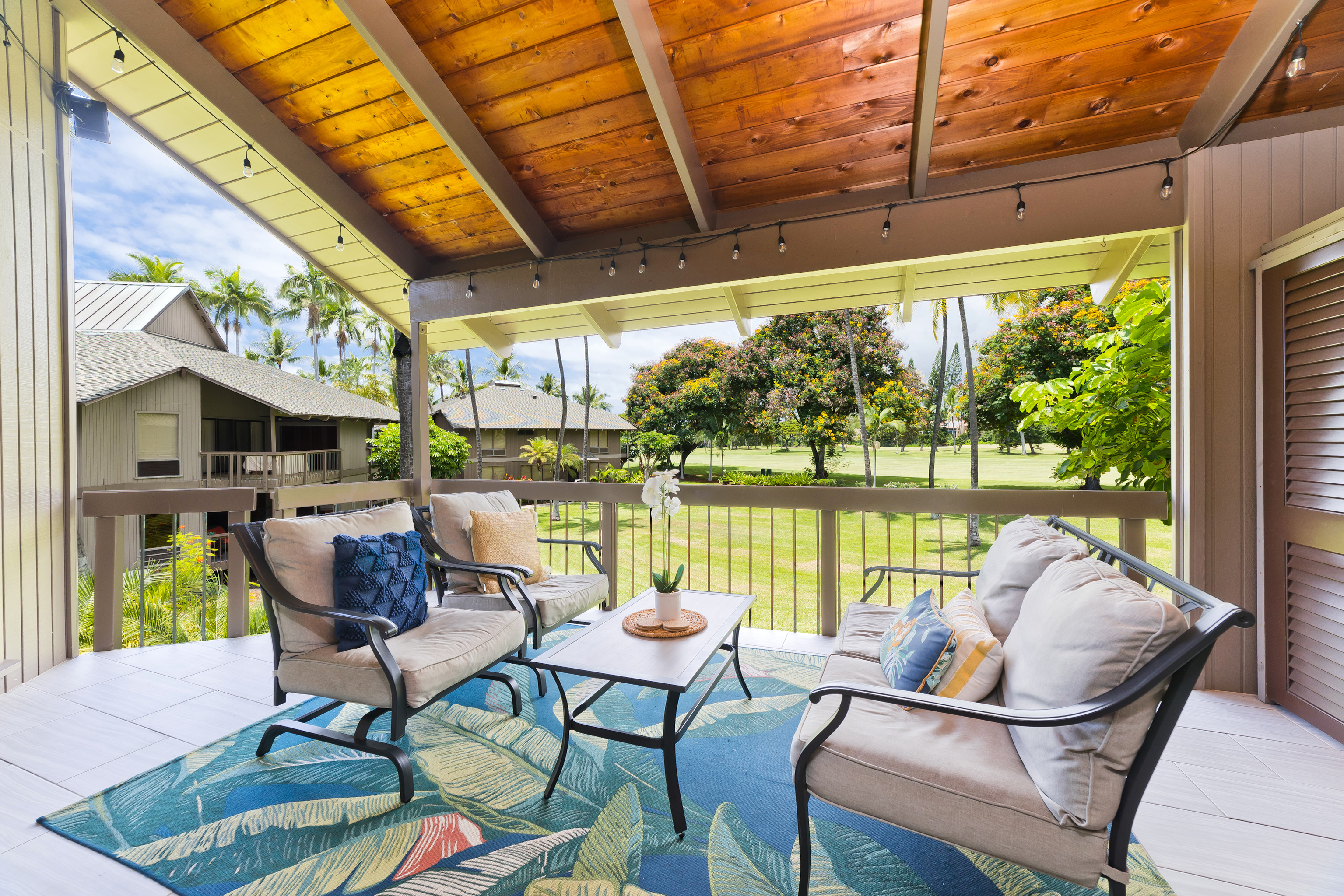 78-261 Manukai Street, Unit 303 Kailua-Kona, HI 96740 - Photo 23 of 30 a dining room with furniture and a floor to ceiling window