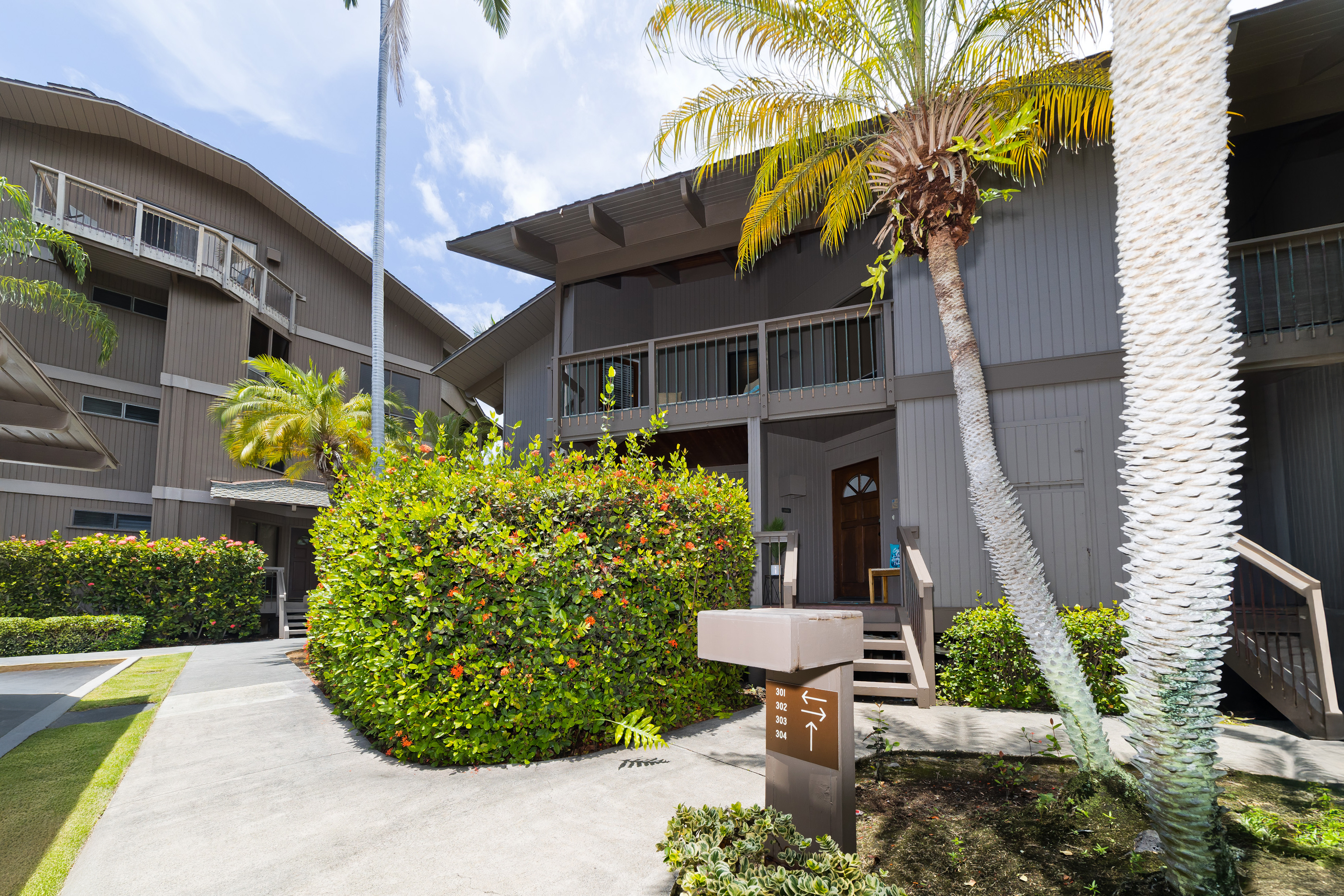 78-261 Manukai Street, Unit 303 Kailua-Kona, HI 96740 - Photo 24 of 30 a view of a house with potted plants