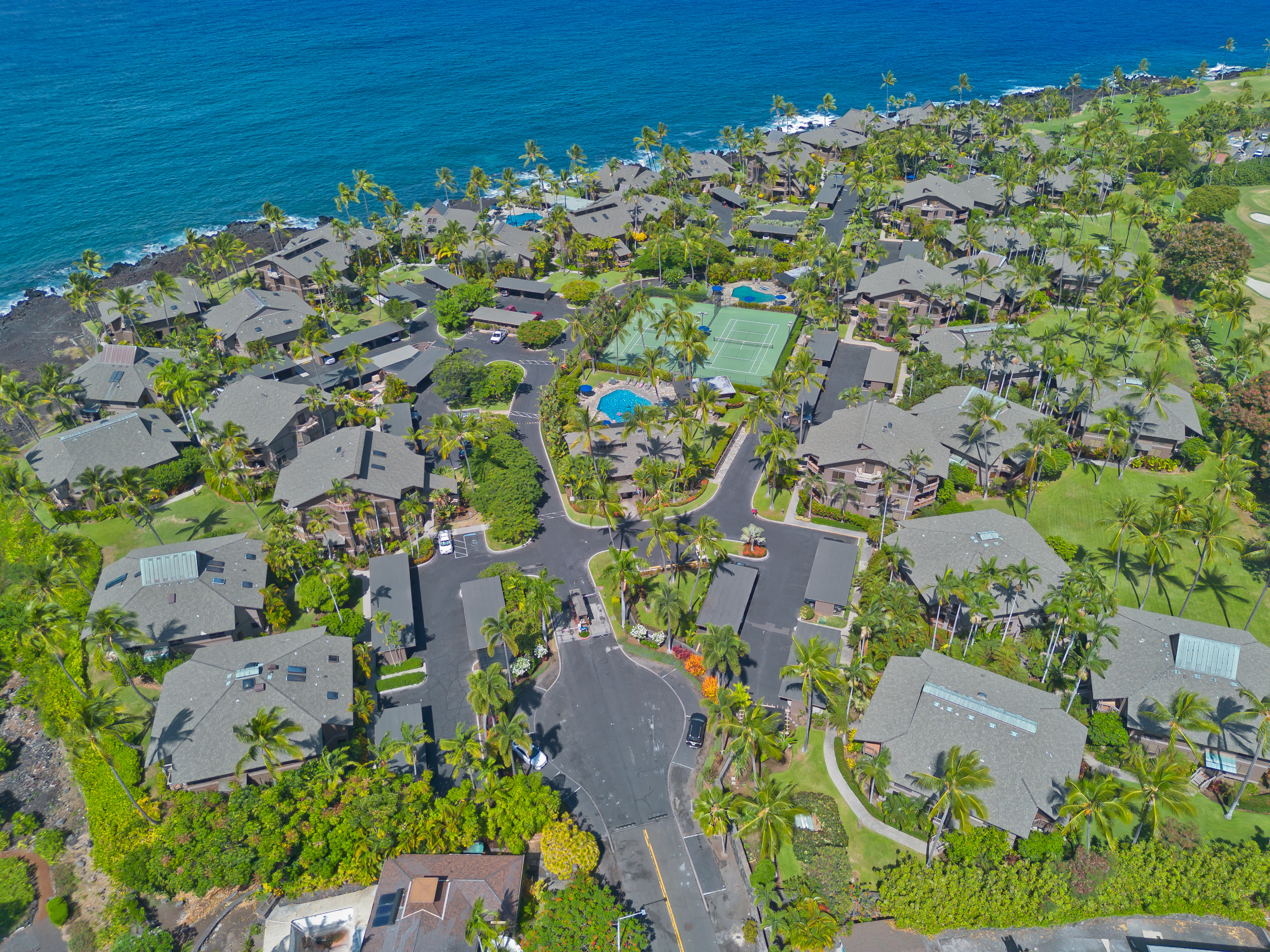 78-261 Manukai Street, Unit 303 Kailua-Kona, HI 96740 - Photo 27 of 30 an aerial view of a houses with a yard