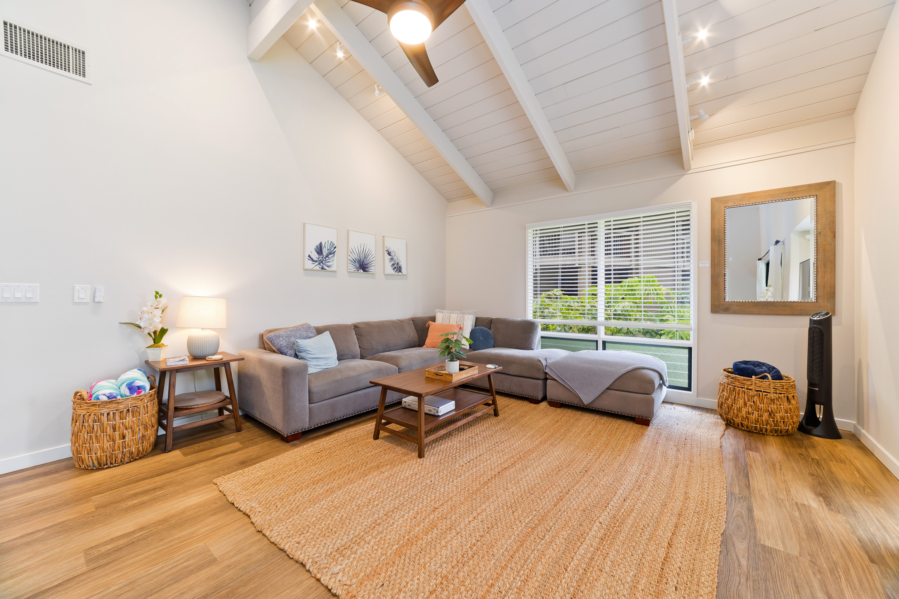 78-261 Manukai Street, Unit 303 Kailua-Kona, HI 96740 - Photo 5 of 30 a living room with furniture and a large window
