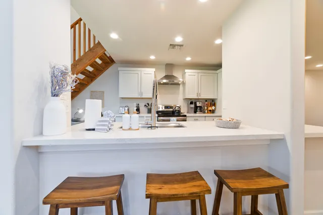 a kitchen with a sink cabinets and window