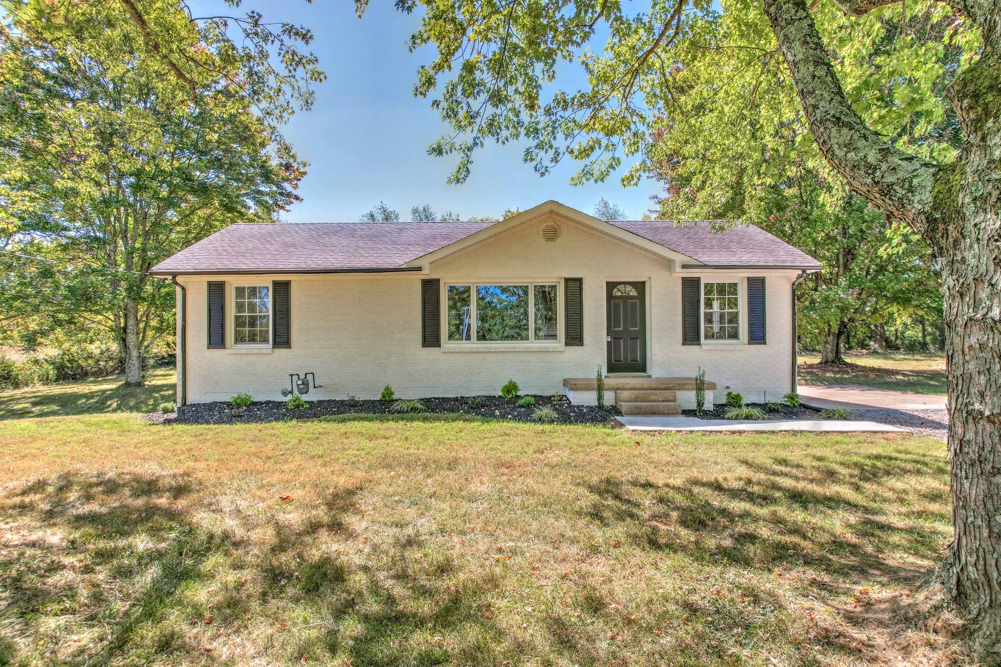 746 Clearview Road Cottontown, TN 37048 - Photo 2 of 64 a front view of a house with a garden