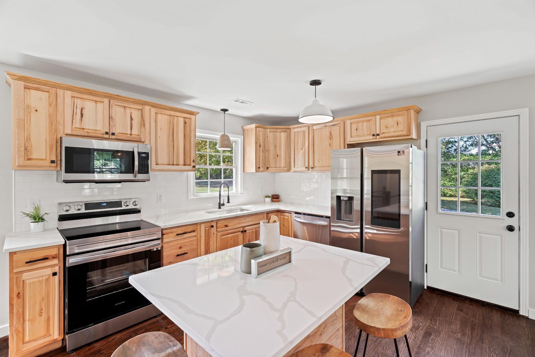 746 Clearview Road Cottontown, TN 37048 - Photo 21 of 64 a kitchen with stainless steel appliances wooden floor and a refrigerator
