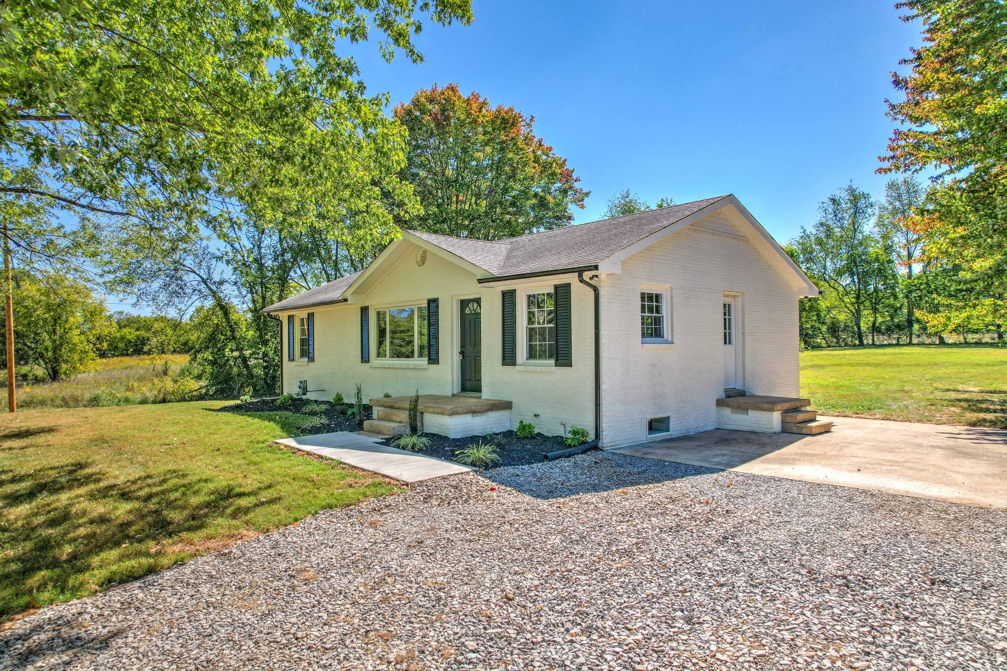 746 Clearview Road Cottontown, TN 37048 - Photo 3 of 64 a front view of a house with a yard and garage