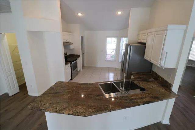 a view of a kitchen with a sink