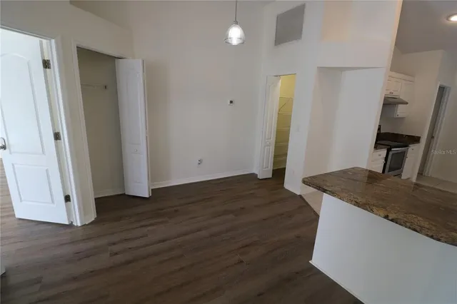 a kitchen with a granite countertop window and a sink