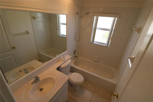 a bathroom with a sink a toilet and a bathtub
