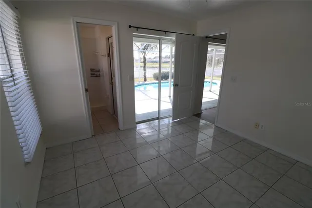 a view of an empty room and window