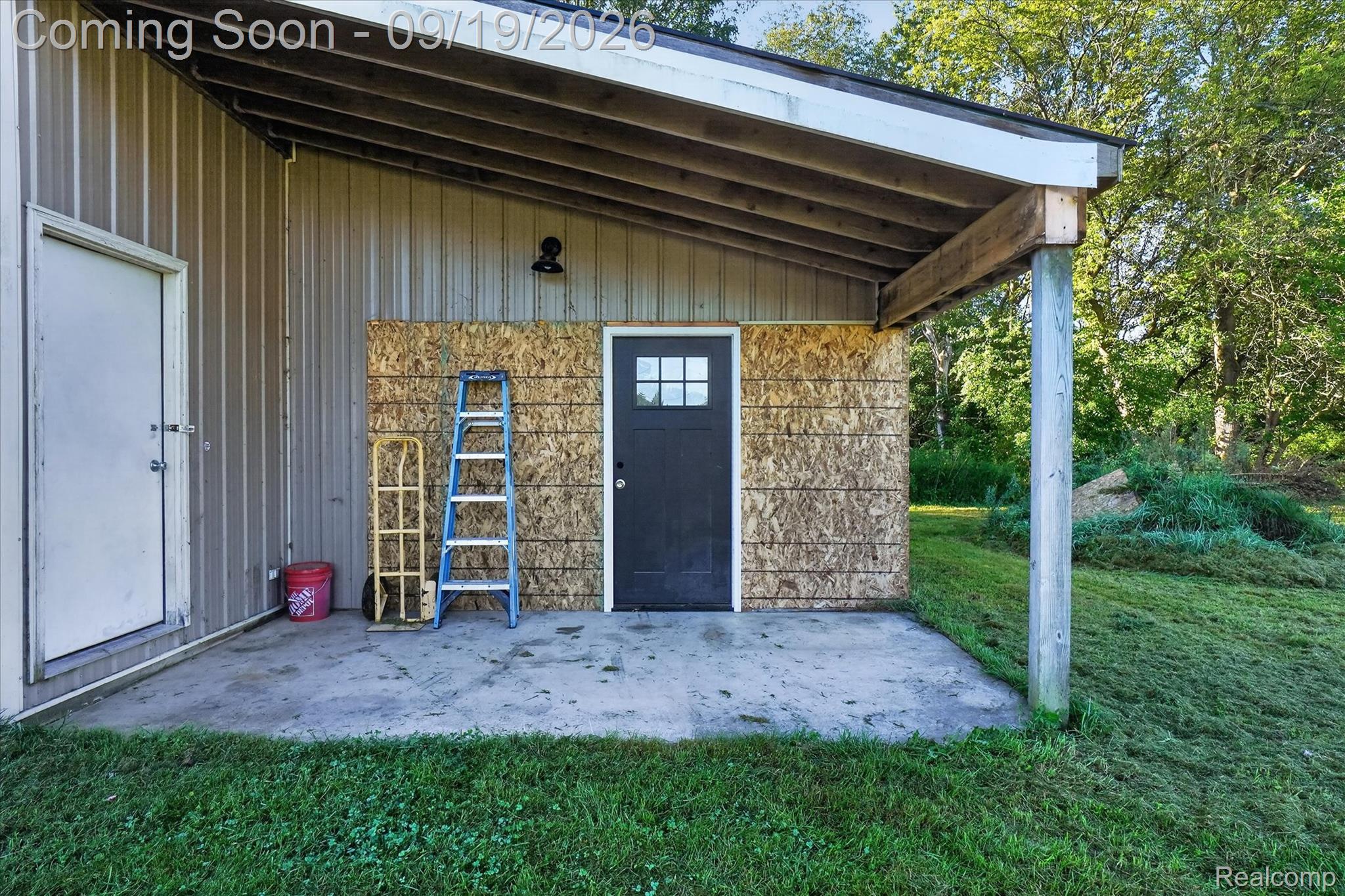 10215 West Mount Morris Road Flushing, MI 48433 - Photo 40 of 58 Metal siding building with an attached covered concrete patio