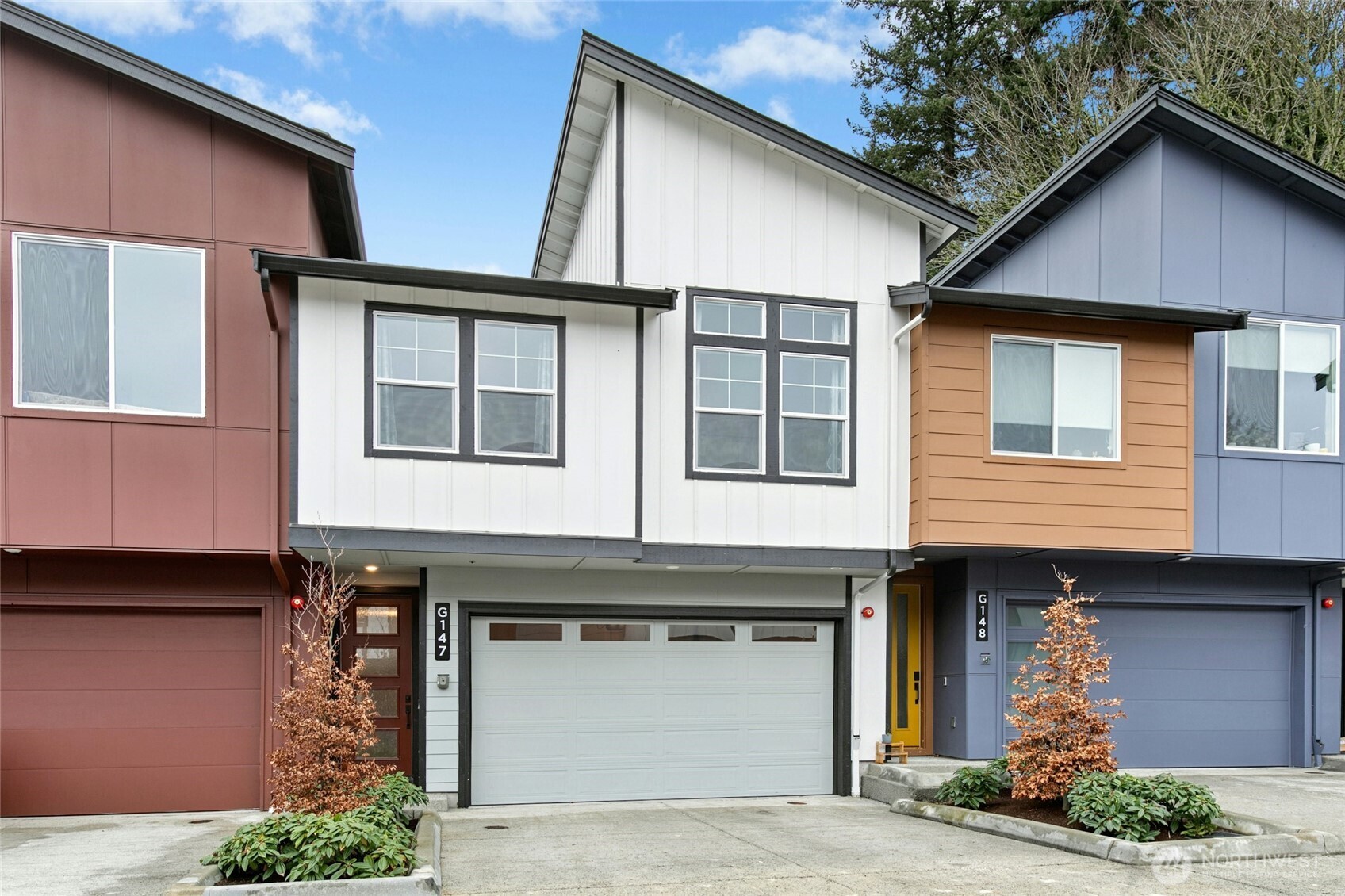 a front view of a house with garden