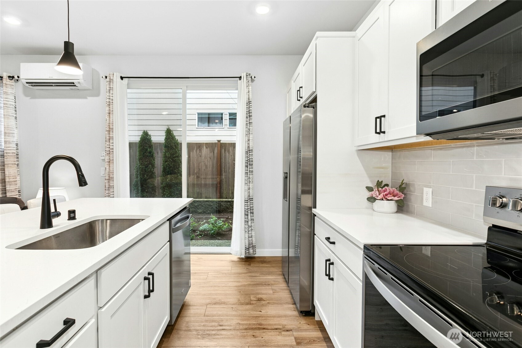8609 Soper Hill Road, Unit G147 Marysville, WA 98270 - Photo 11 of 28 a kitchen with white cabinets a sink and appliances