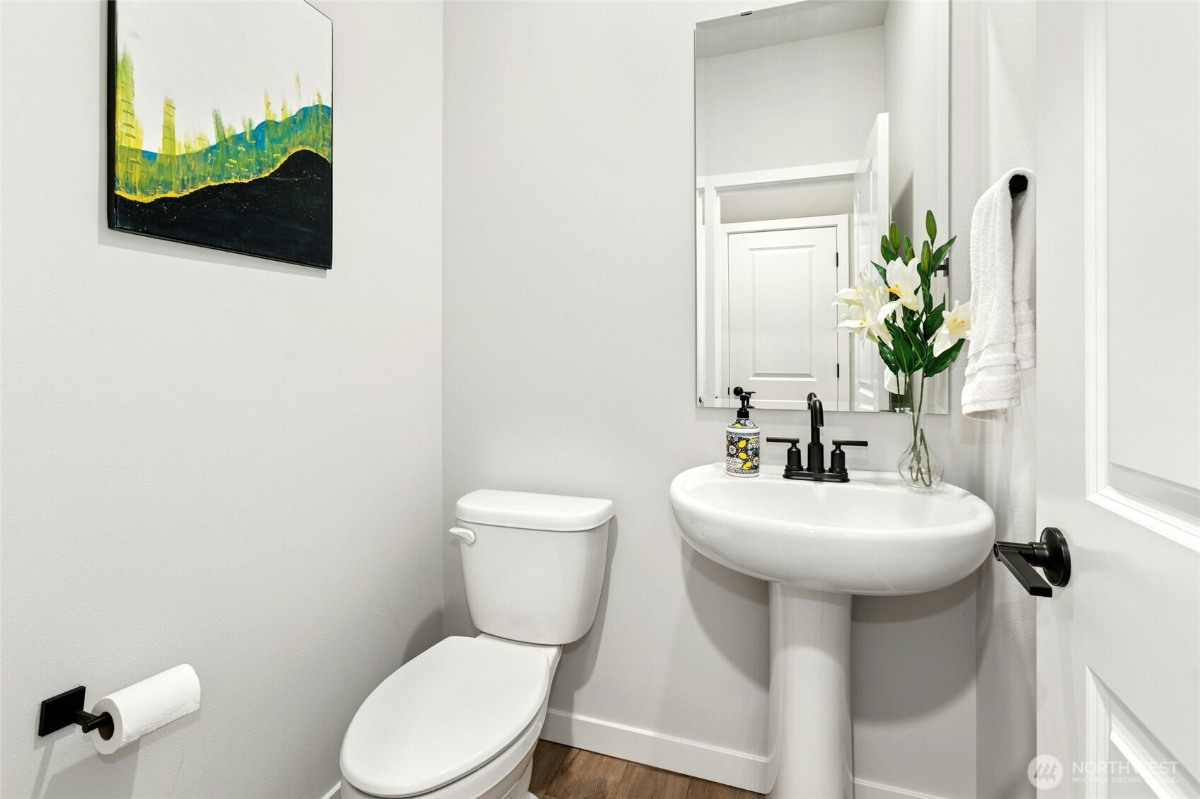 8609 Soper Hill Road, Unit G147 Marysville, WA 98270 - Photo 13 of 28 a bathroom with a toilet sink and mirror