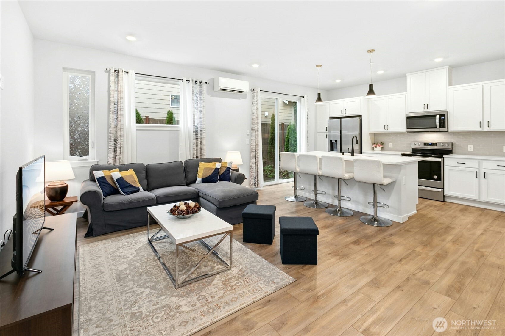 8609 Soper Hill Road, Unit G147 Marysville, WA 98270 - Photo 5 of 28 a living room with furniture kitchen view and a wooden floor