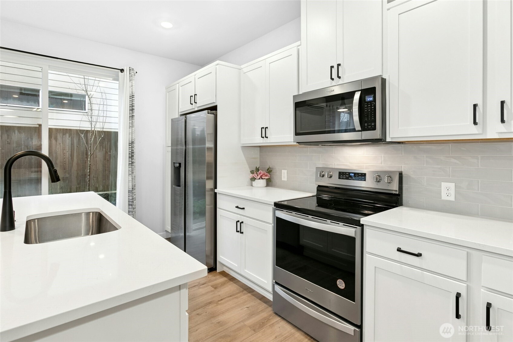 8609 Soper Hill Road, Unit G147 Marysville, WA 98270 - Photo 10 of 28 a kitchen with stainless steel appliances white cabinets and a stove
