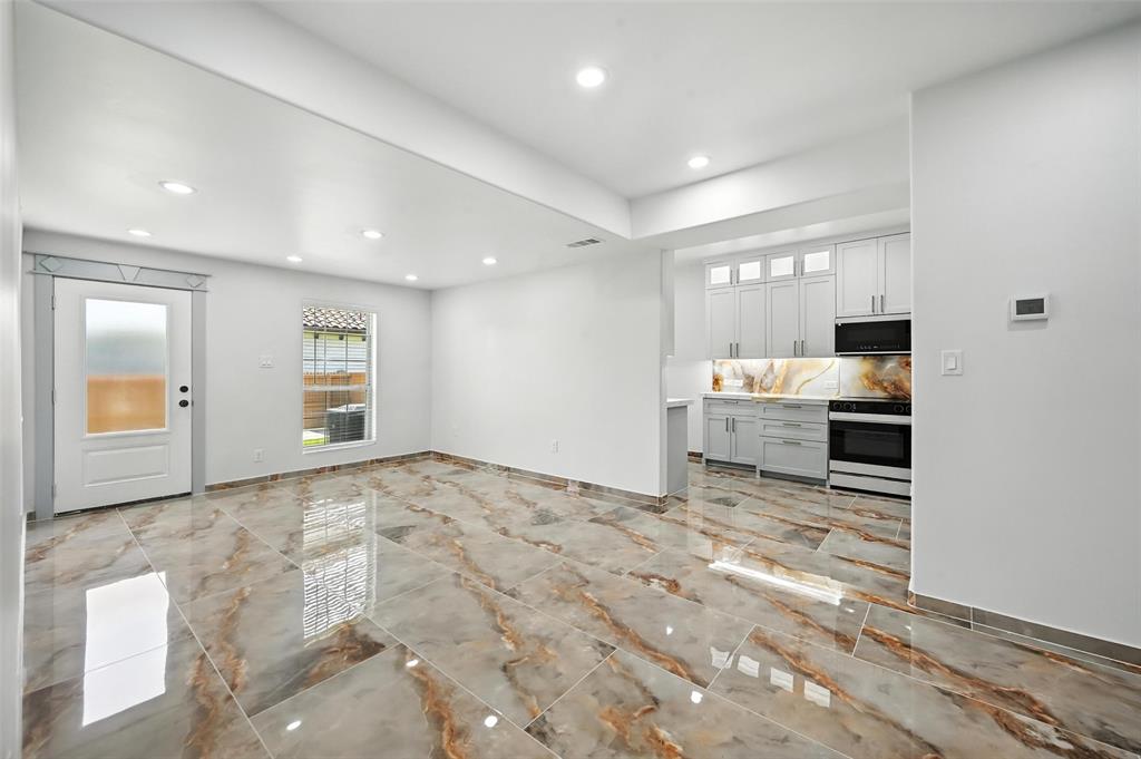 934 Elwood Road Irving, TX 75061 - Photo 32 of 40 a view of a kitchen with wooden floor and staircase