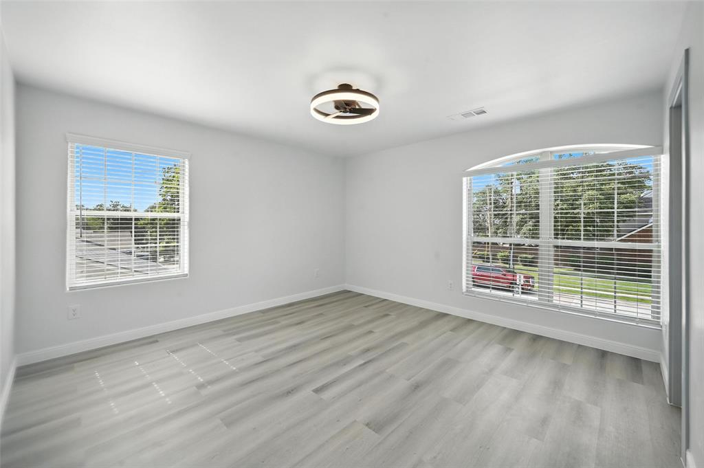 934 Elwood Road Irving, TX 75061 - Photo 9 of 40 a view of an empty room with a window