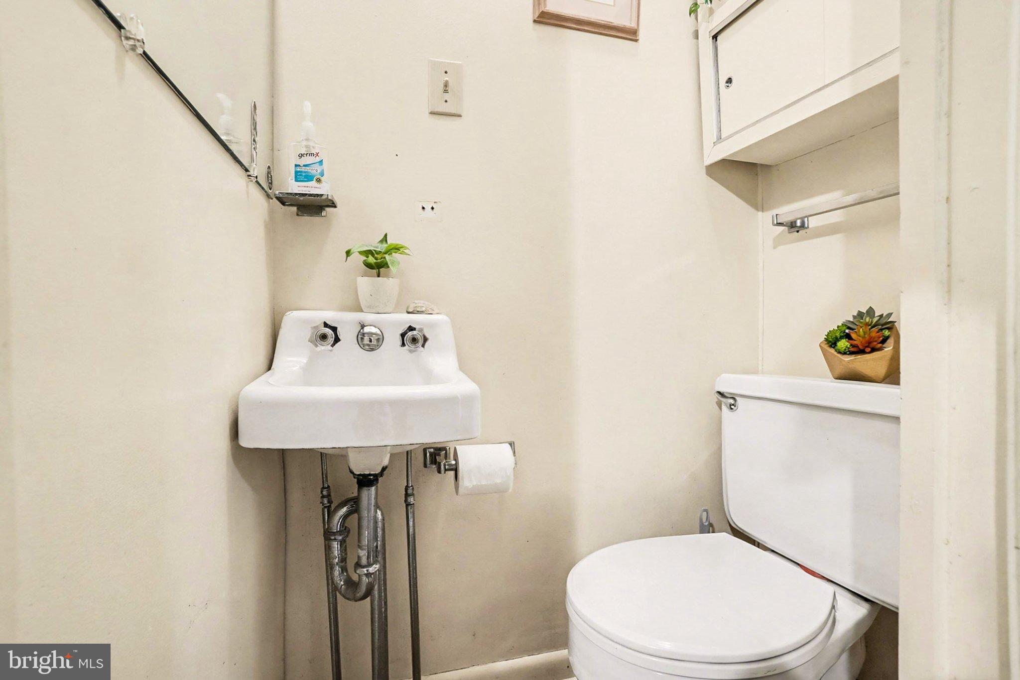 534 Main Street Lykens, PA 17048 - Photo 11 of 29 a bathroom with a sink a toilet and mirror