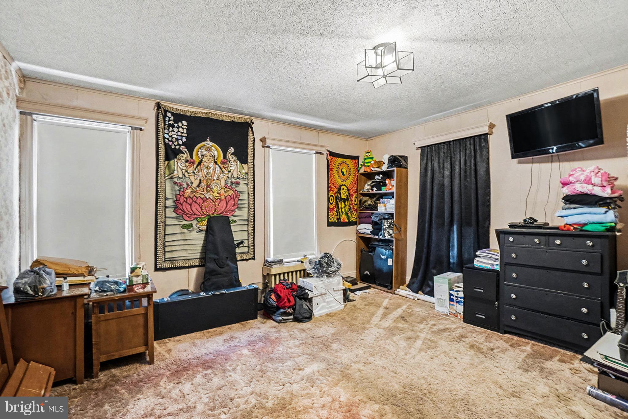 534 Main Street Lykens, PA 17048 - Photo 13 of 29 a bed room with a bed and a television