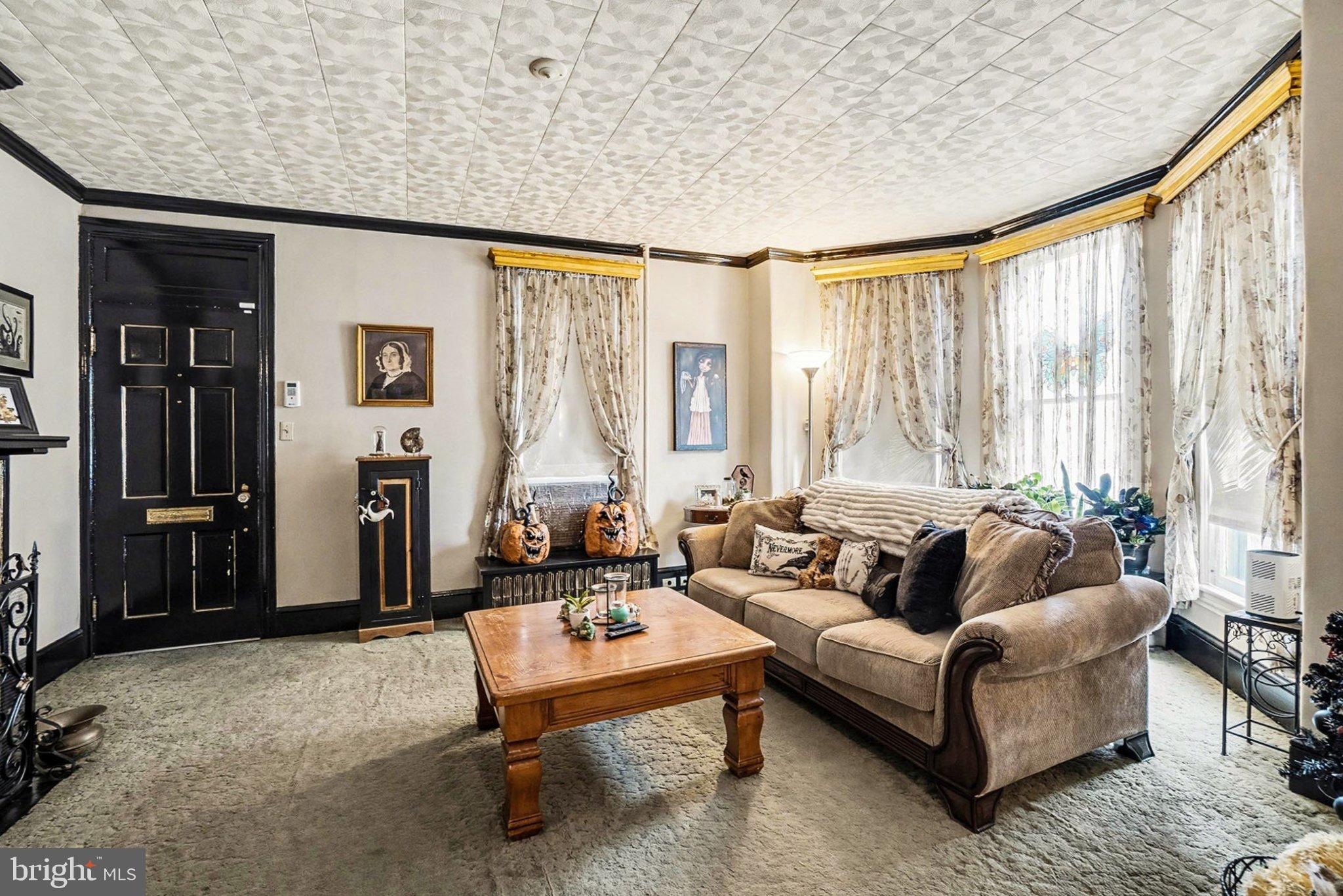 534 Main Street Lykens, PA 17048 - Photo 2 of 29 a living room with furniture and a large window