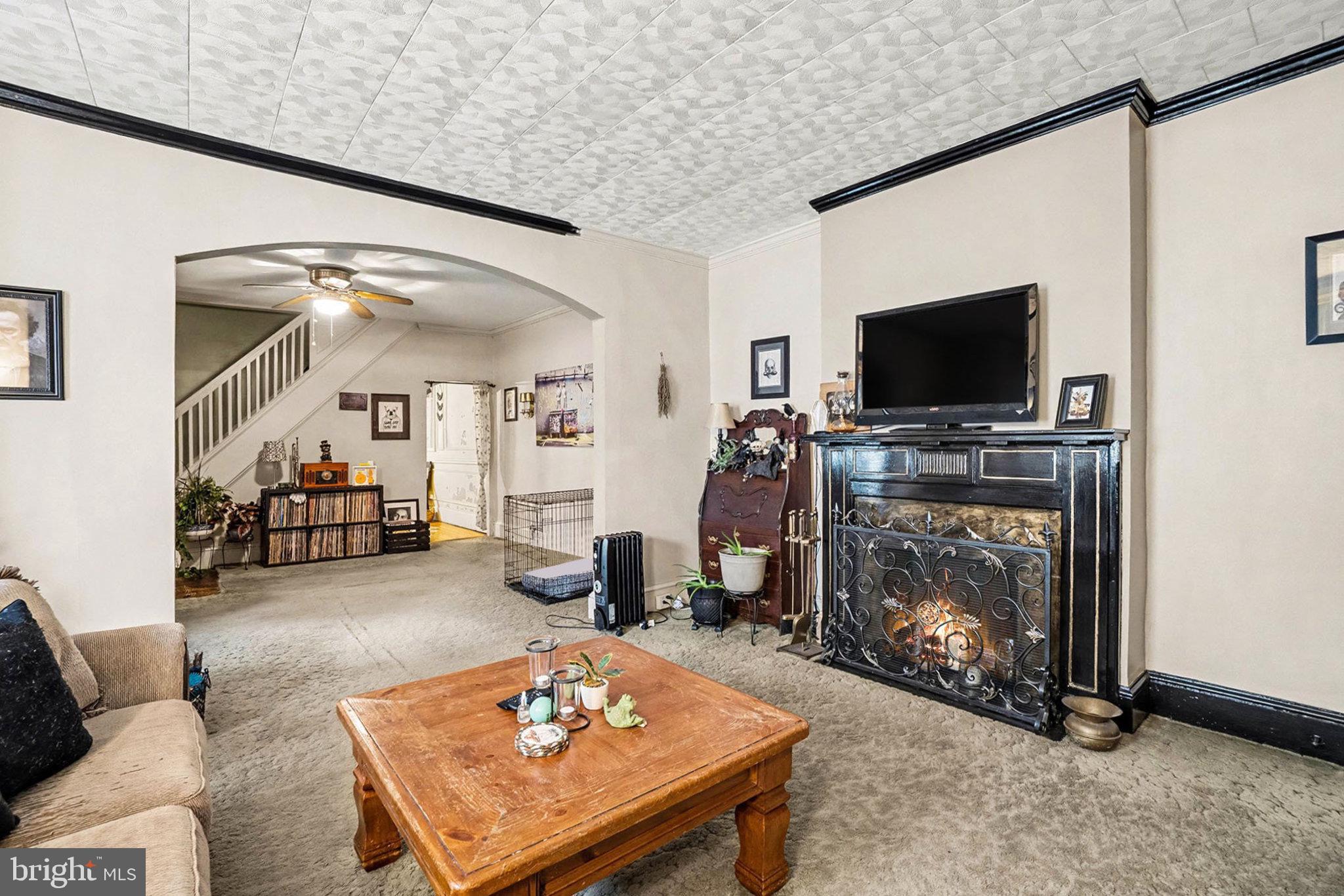 534 Main Street Lykens, PA 17048 - Photo 3 of 29 a living room with furniture a flat screen tv and a fireplace