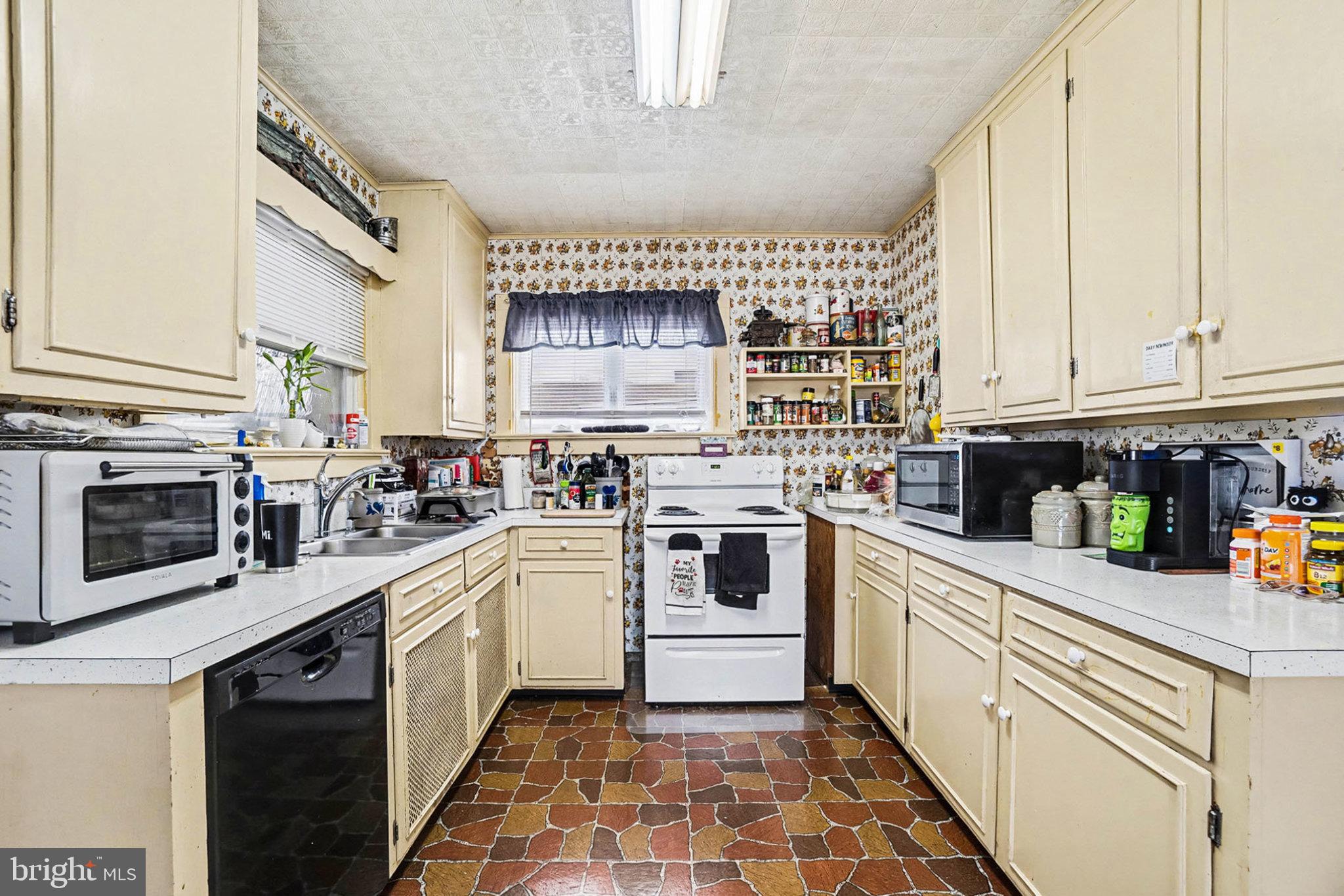 534 Main Street Lykens, PA 17048 - Photo 9 of 29 a kitchen with a white cabinets and white appliances