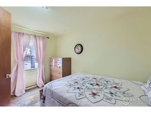 a bedroom with a bed and a cabinets