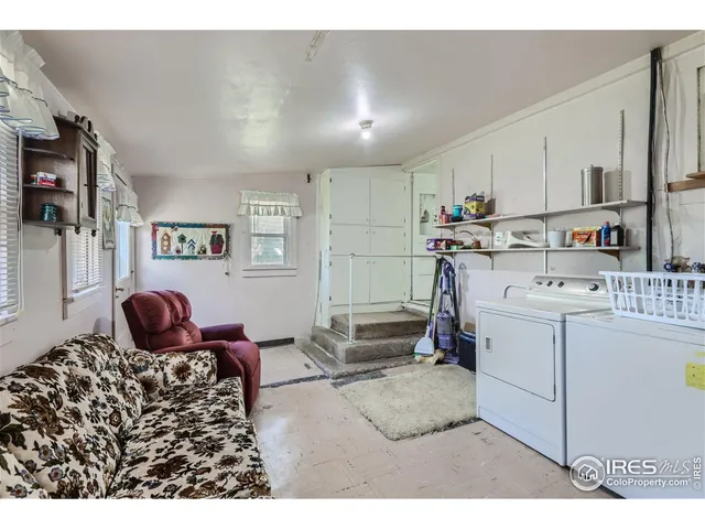 a view of swimming pool with a yard and sitting area