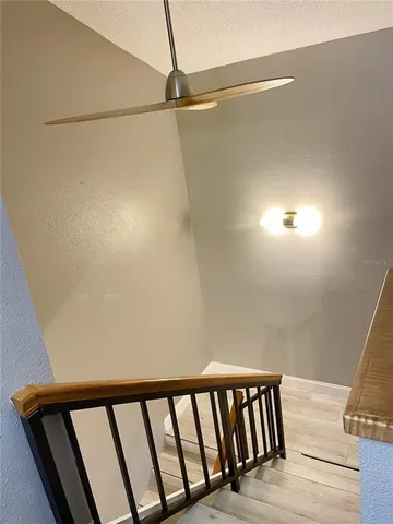 a bedroom with a bed couches and window