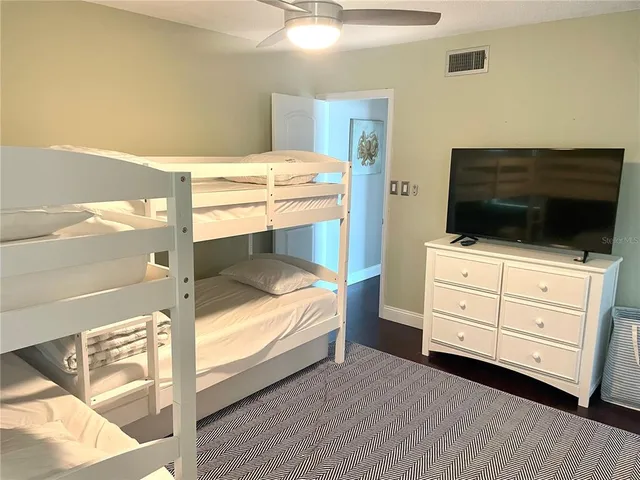 a bedroom with a bed and a table