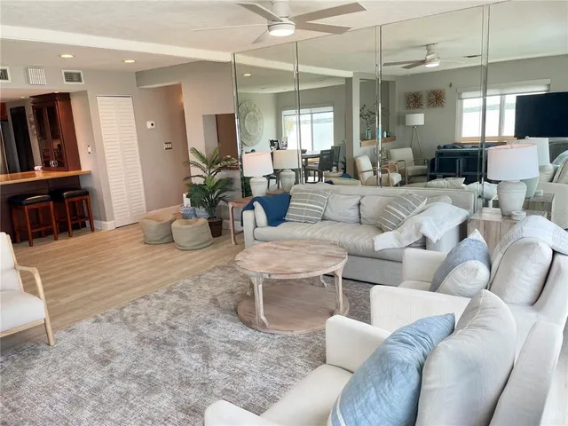 a roof deck with table and chairs