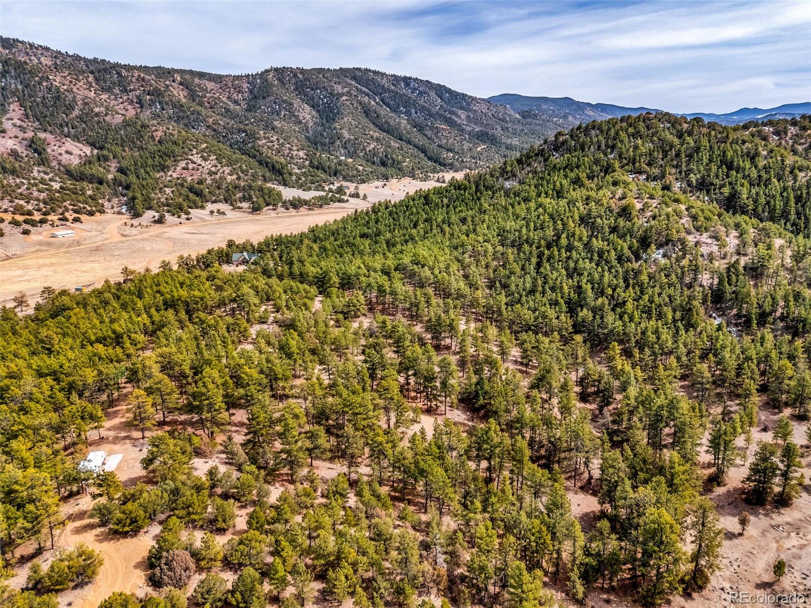 380 Buck Ridge Canon City, CO 81212 - Photo 14 of 28 a view of a large building with mountains in the background