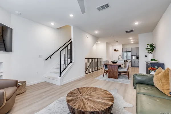 a living room with furniture and a rug