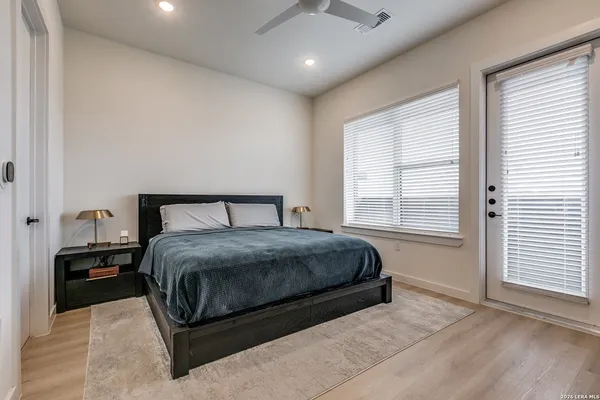 a bedroom with a bed and window