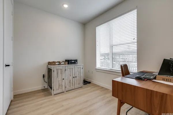 a workspace with furniture and a window