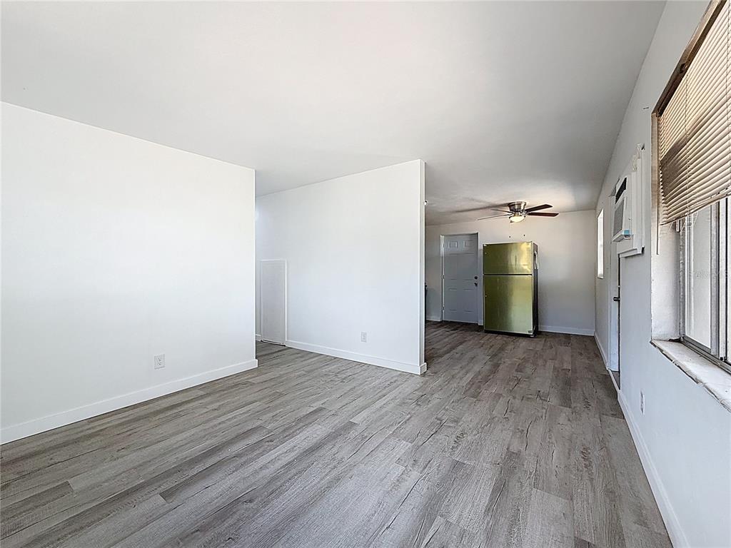 319 Leta Street Auburndale, FL 33823 - Photo 17 of 45 a view of a room with wooden floor and a window