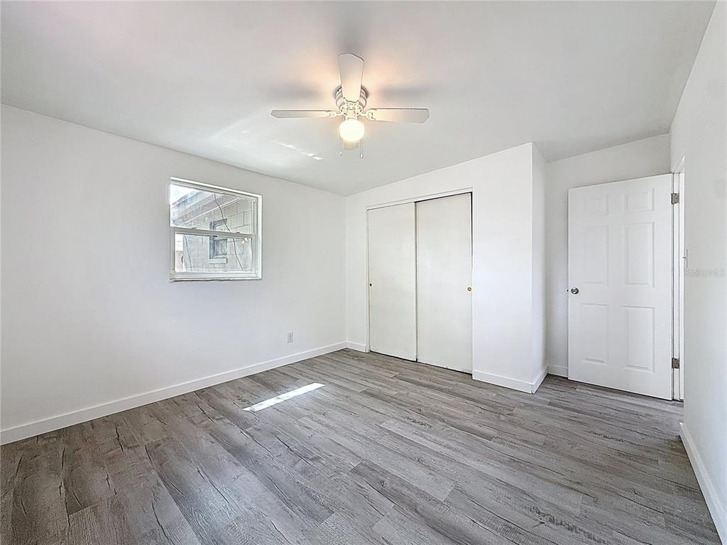 319 Leta Street Auburndale, FL 33823 - Photo 23 of 45 a view of an empty room with wooden floor