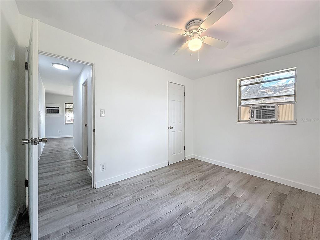 319 Leta Street Auburndale, FL 33823 - Photo 25 of 45 a view of an empty room with wooden floor