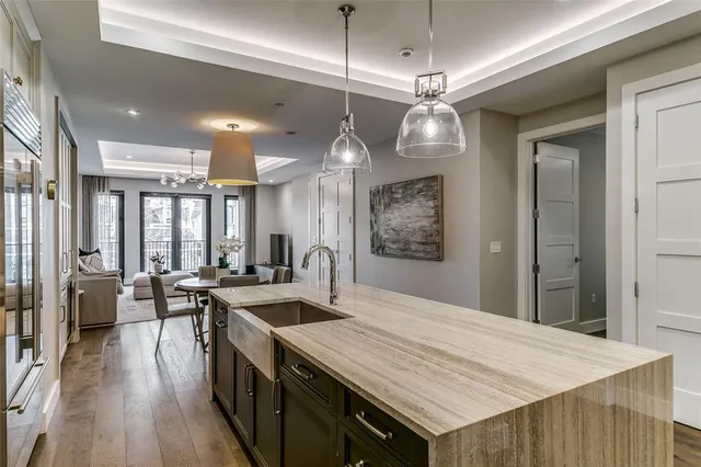 a kitchen with stainless steel appliances granite countertop a stove and a refrigerator