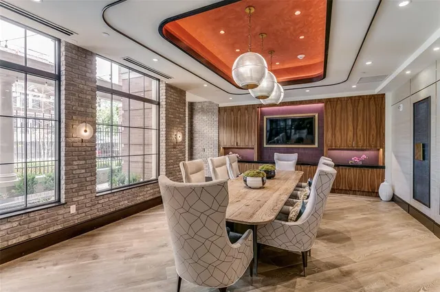 a large kitchen with a large window and stainless steel appliances