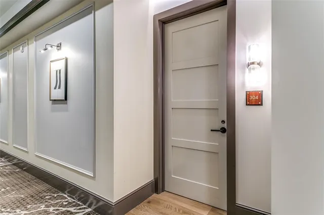a kitchen with a sink and wooden floor