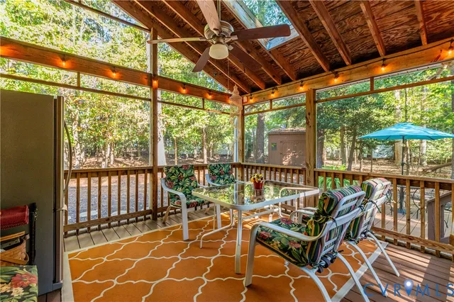 a view of a chairs and table in the patio